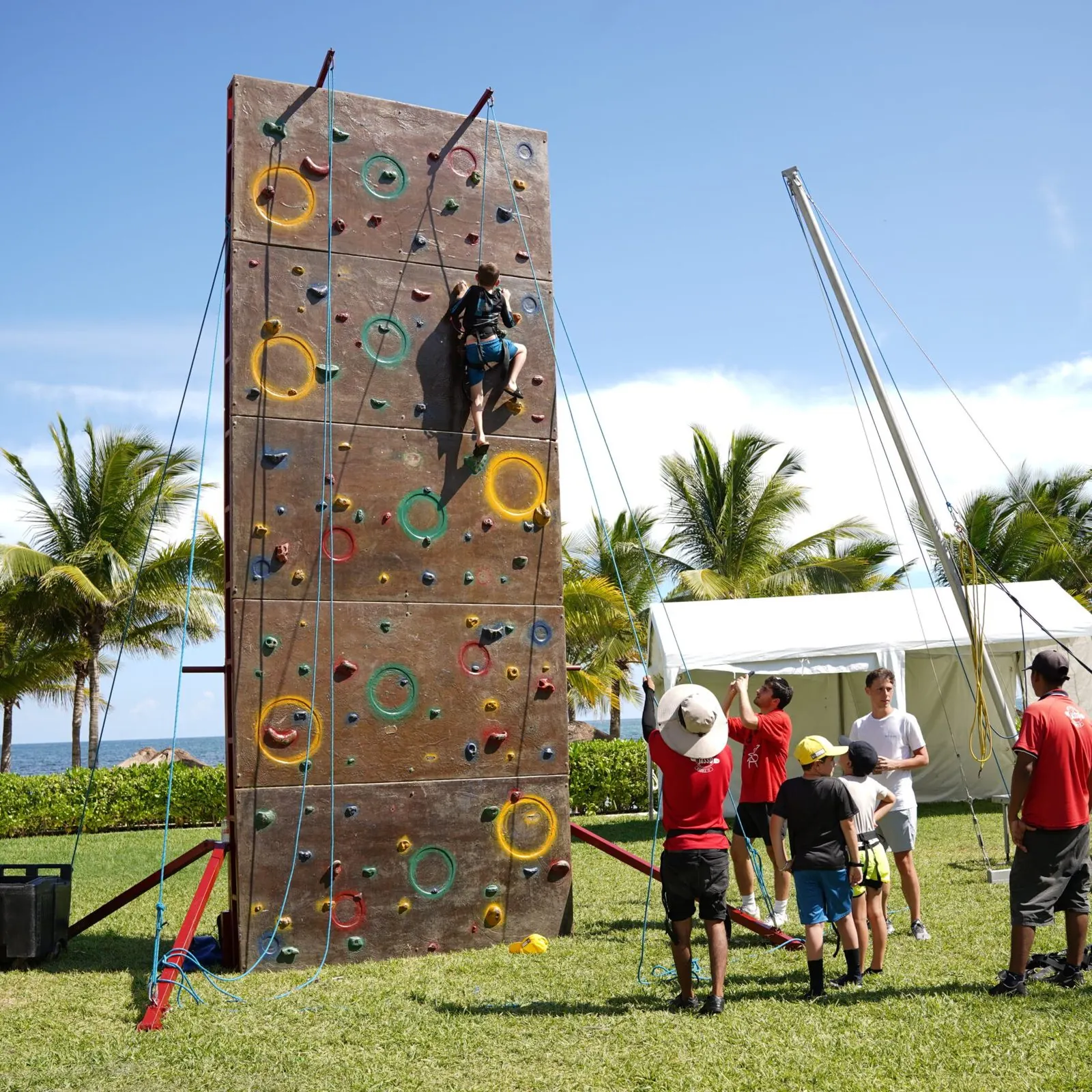 Kids on the climbing wall by the beach
