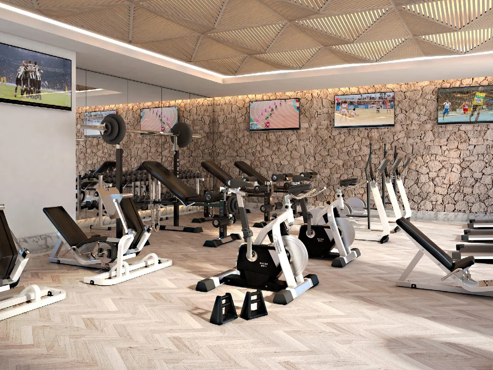 Indoor gym with stone wall and weight machines