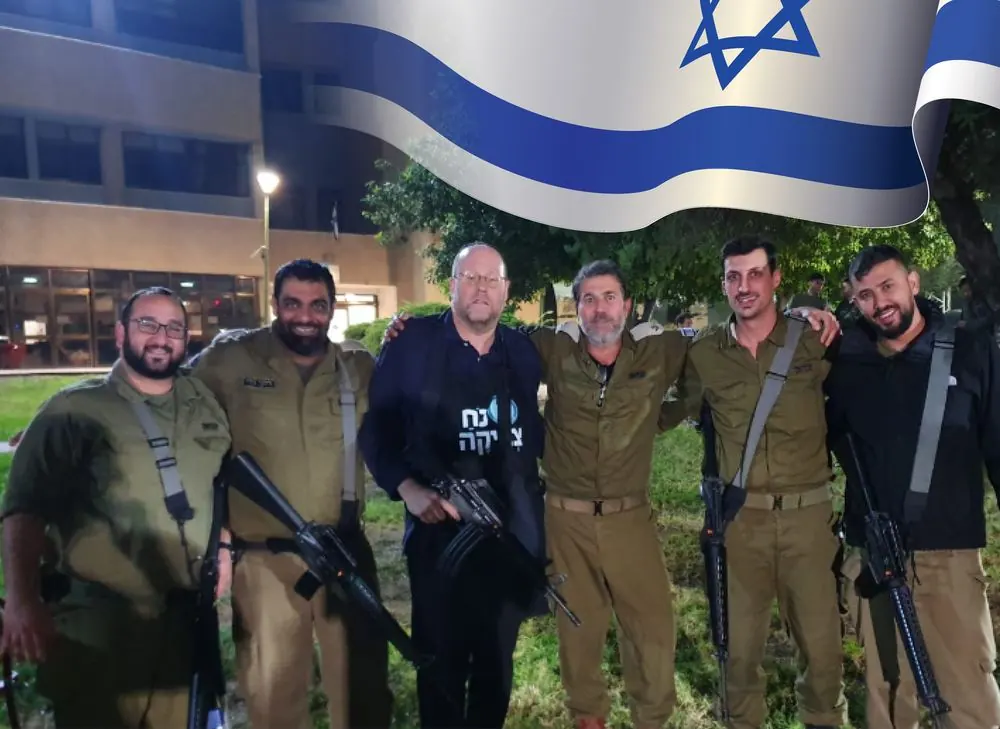 IDF soldiers with the Royal team under an Israeli flag