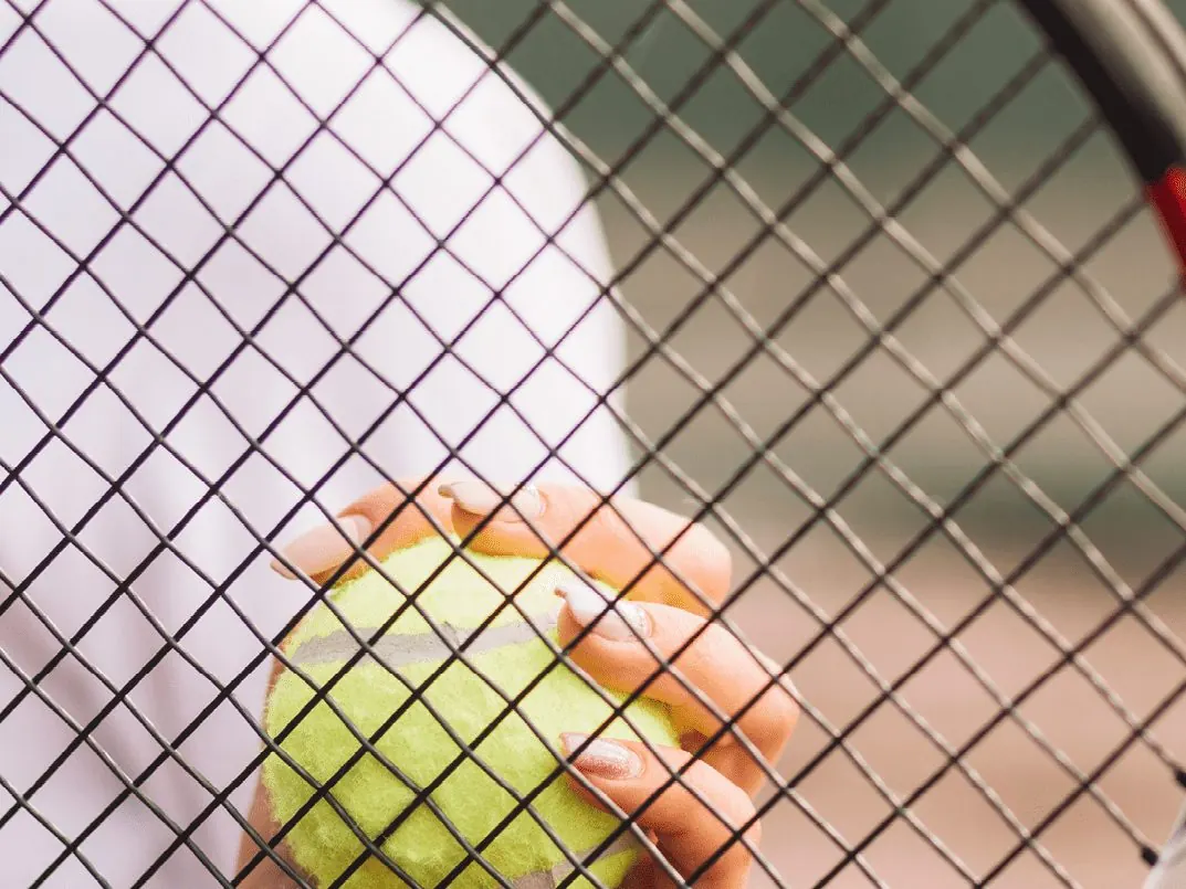 Tennis racquet and ball